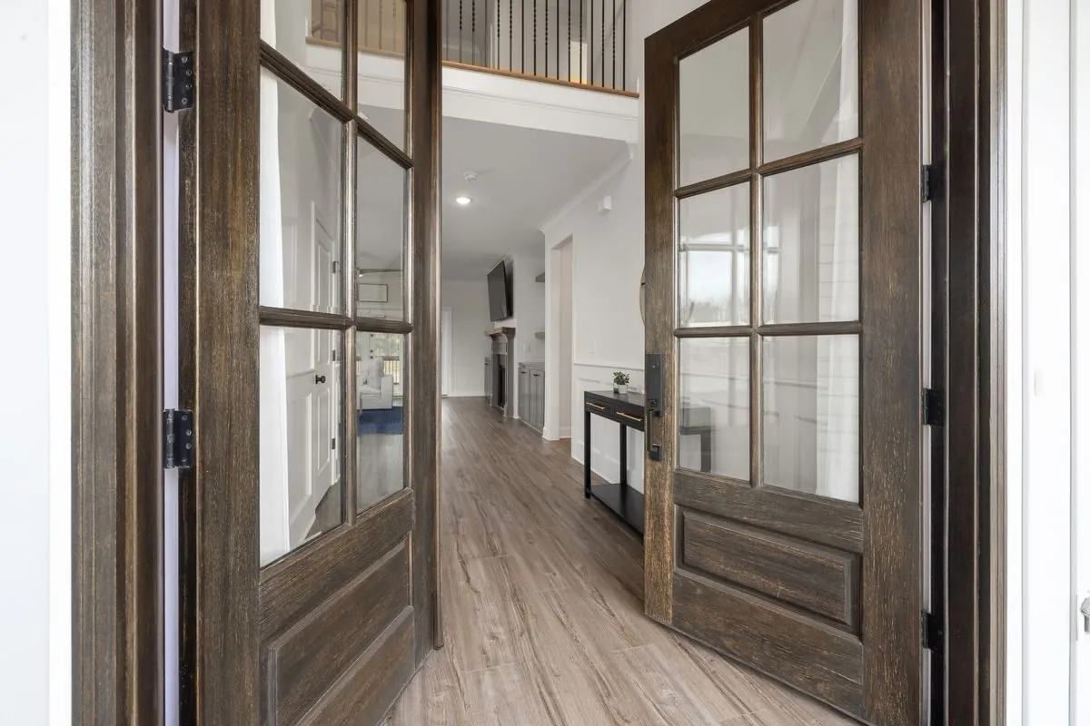 Open doors into a bright hallway
